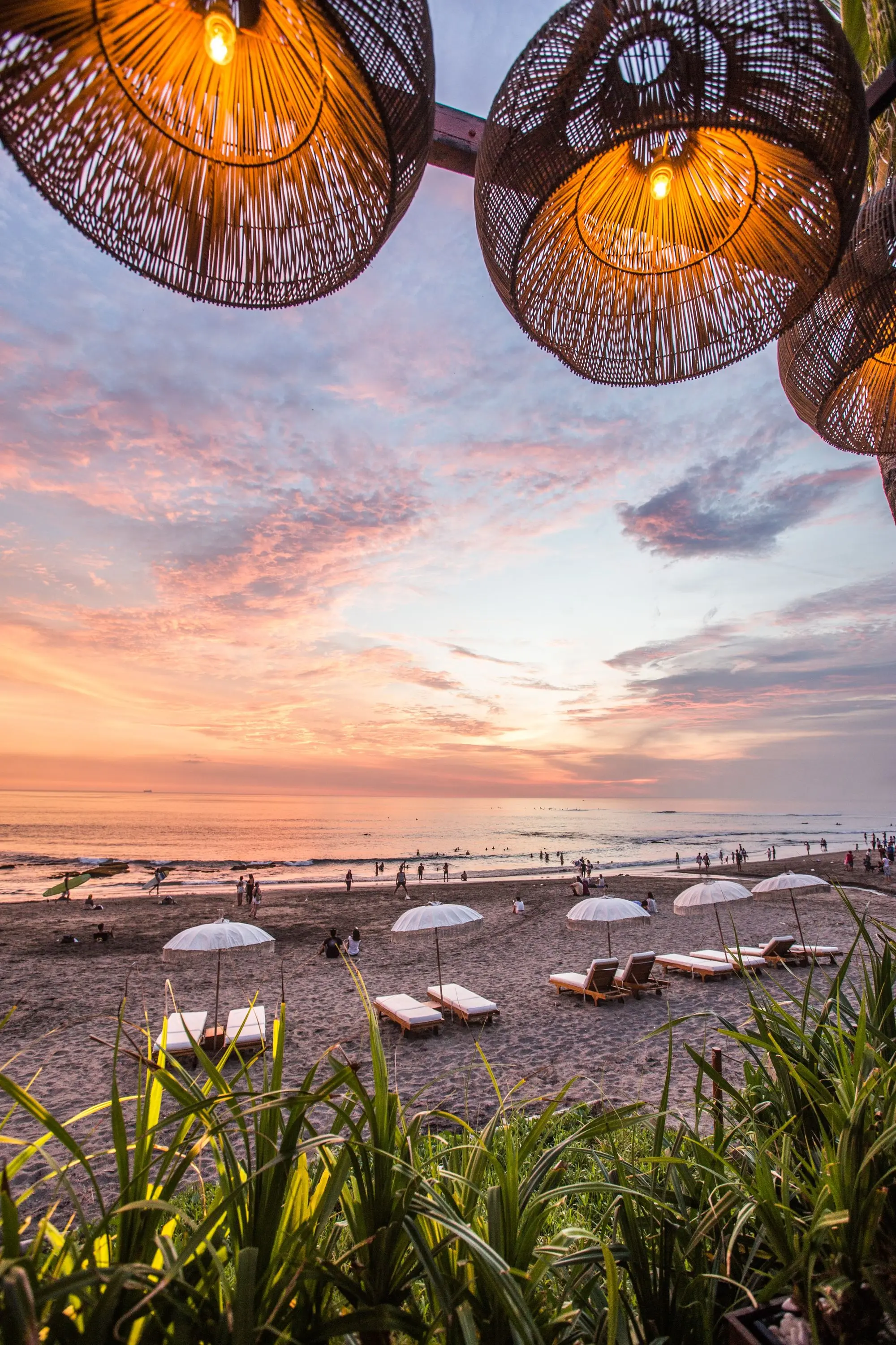 white parasol and lounge near seashore in Canggu