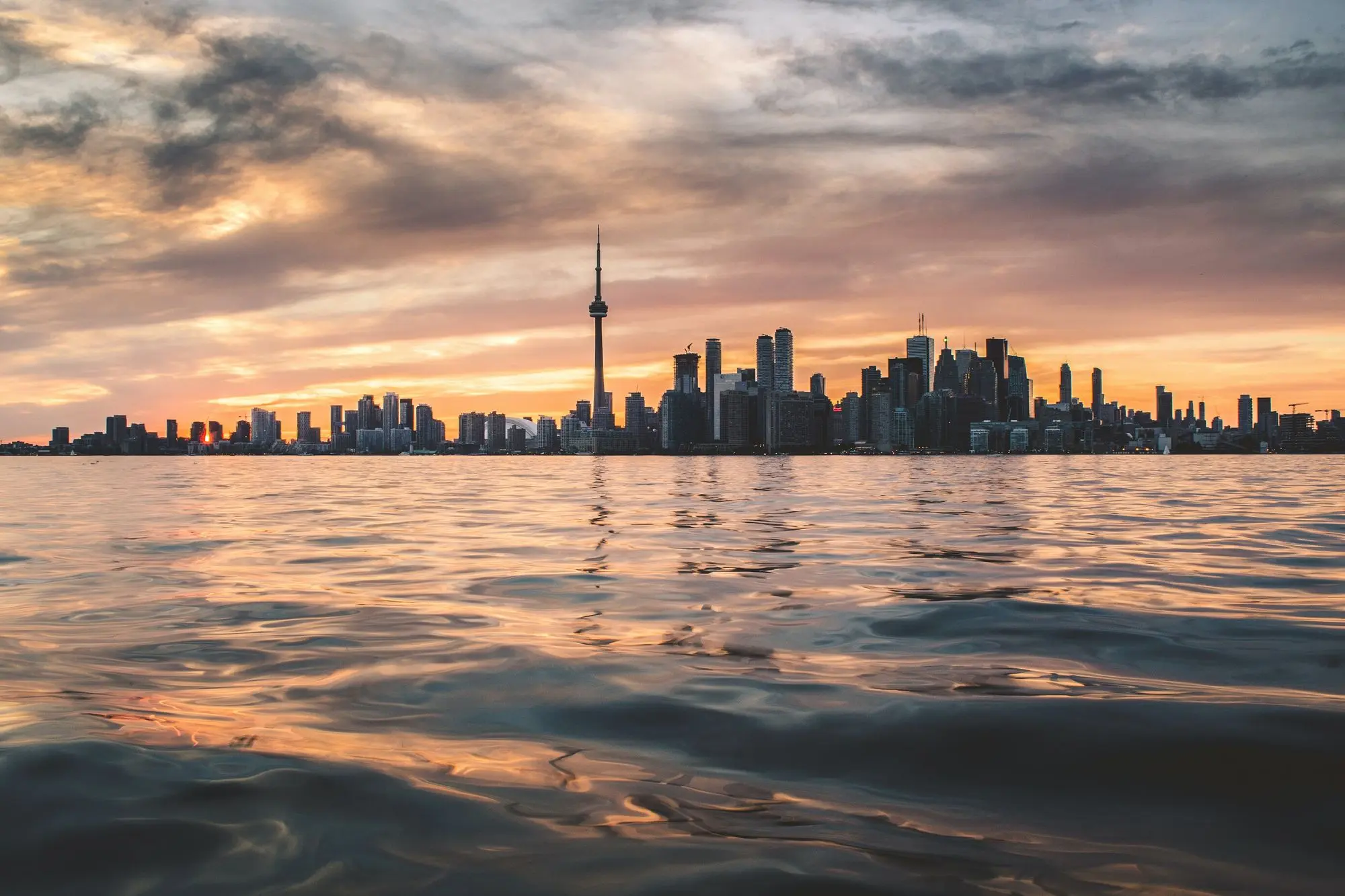body of water under white cloud sky in Toronto
