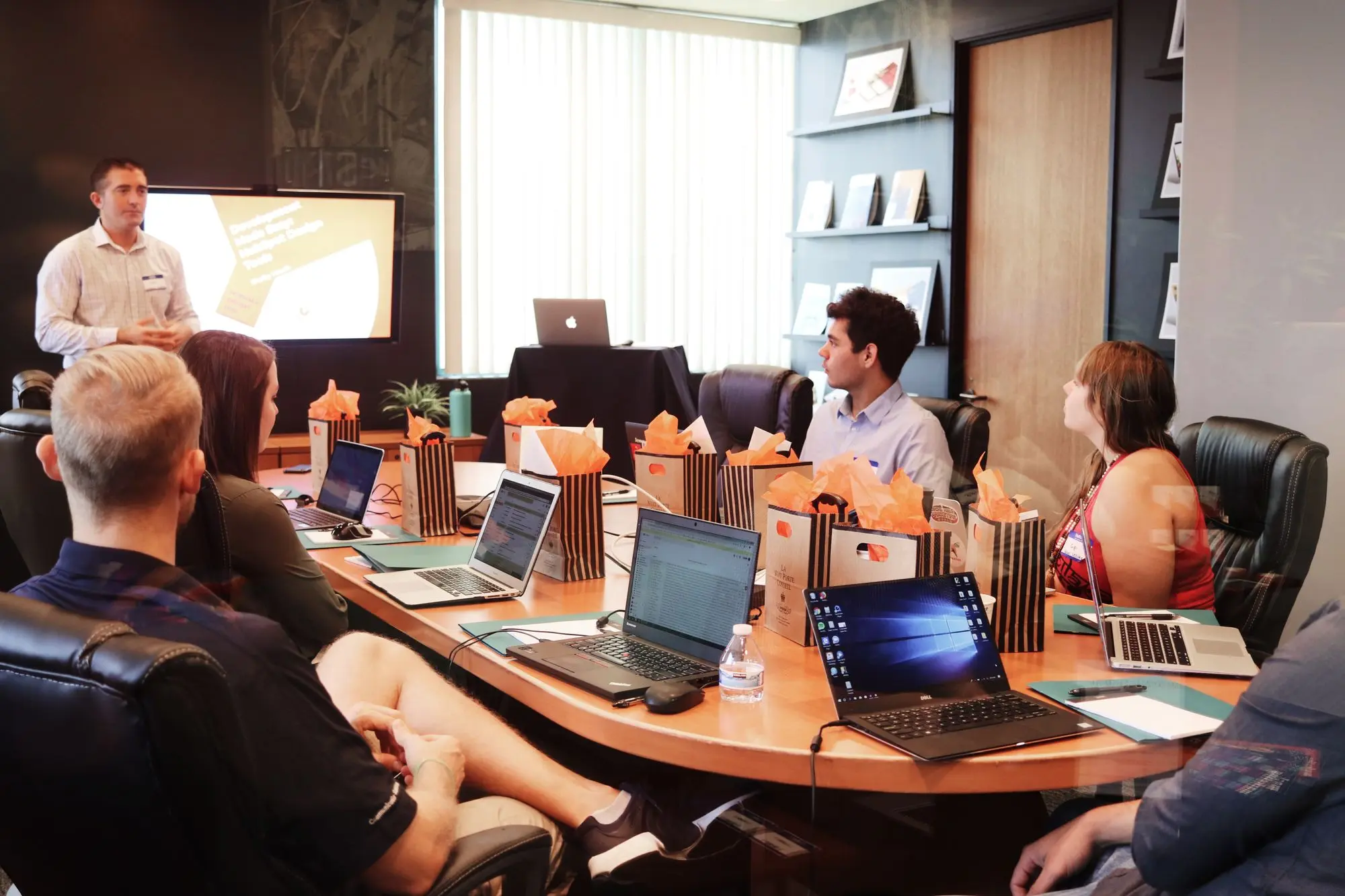 Employees engaged in a meeting in an office