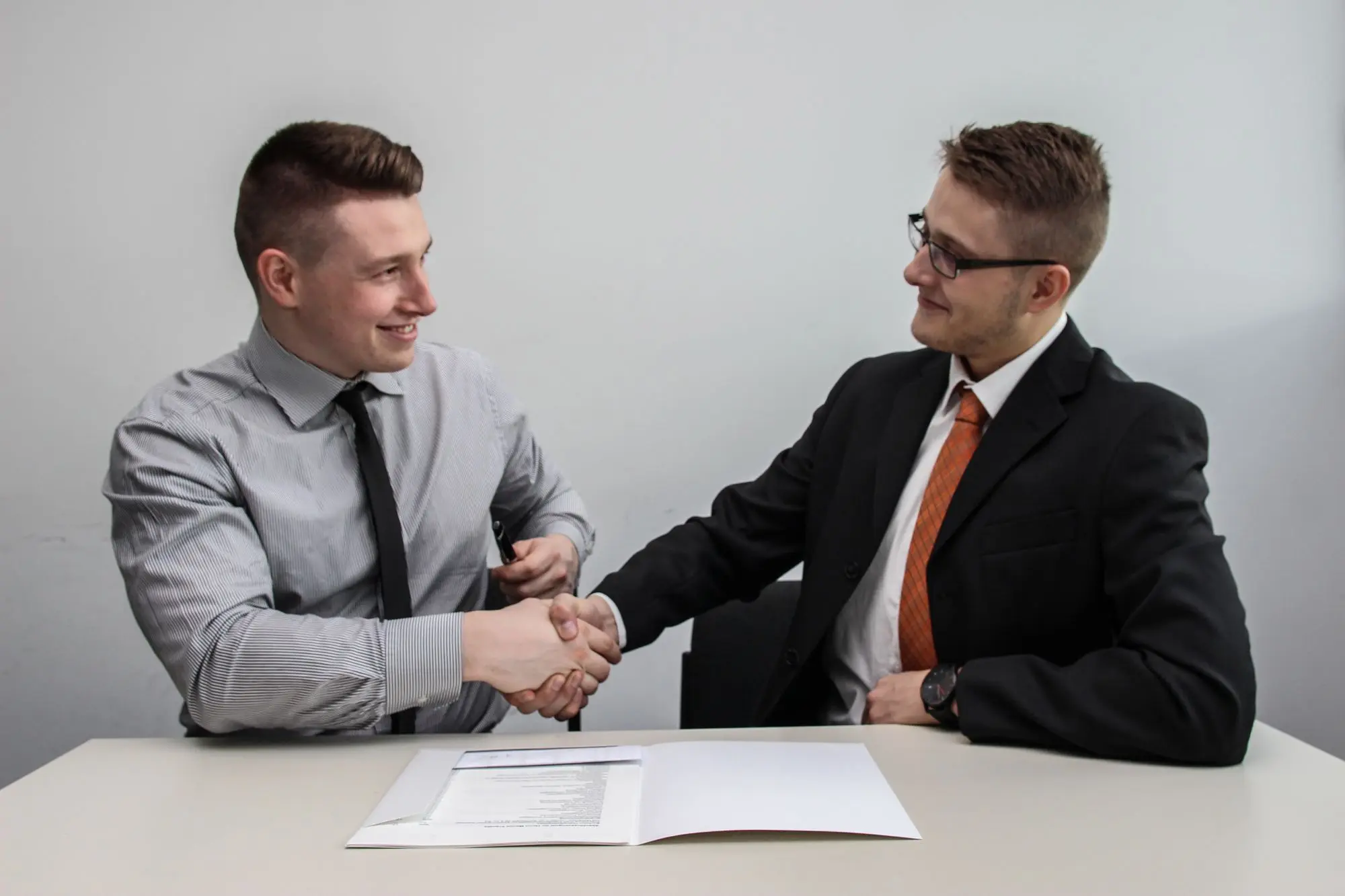 Employee and employer shaking hands