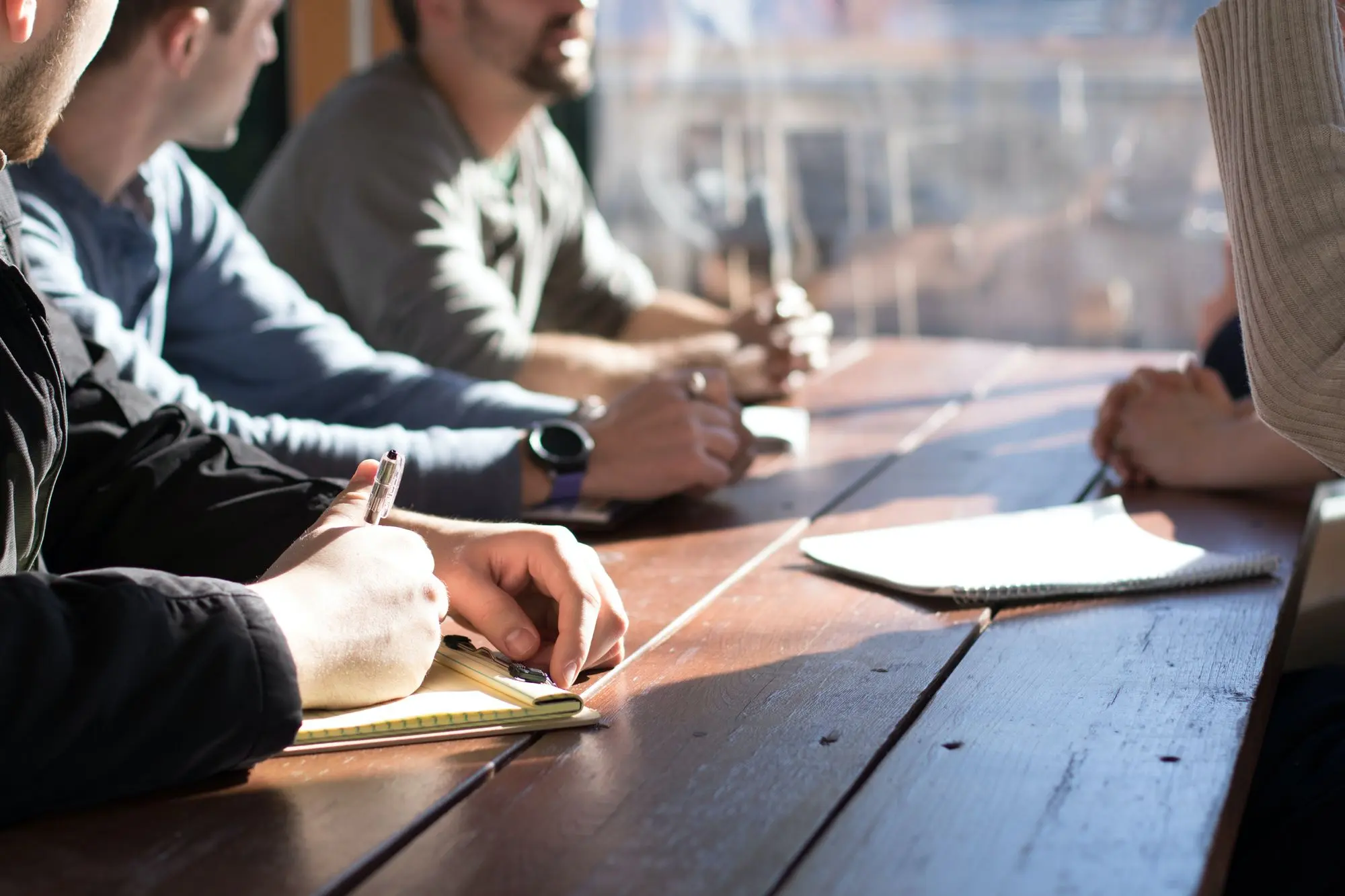 Employees taking notes during work