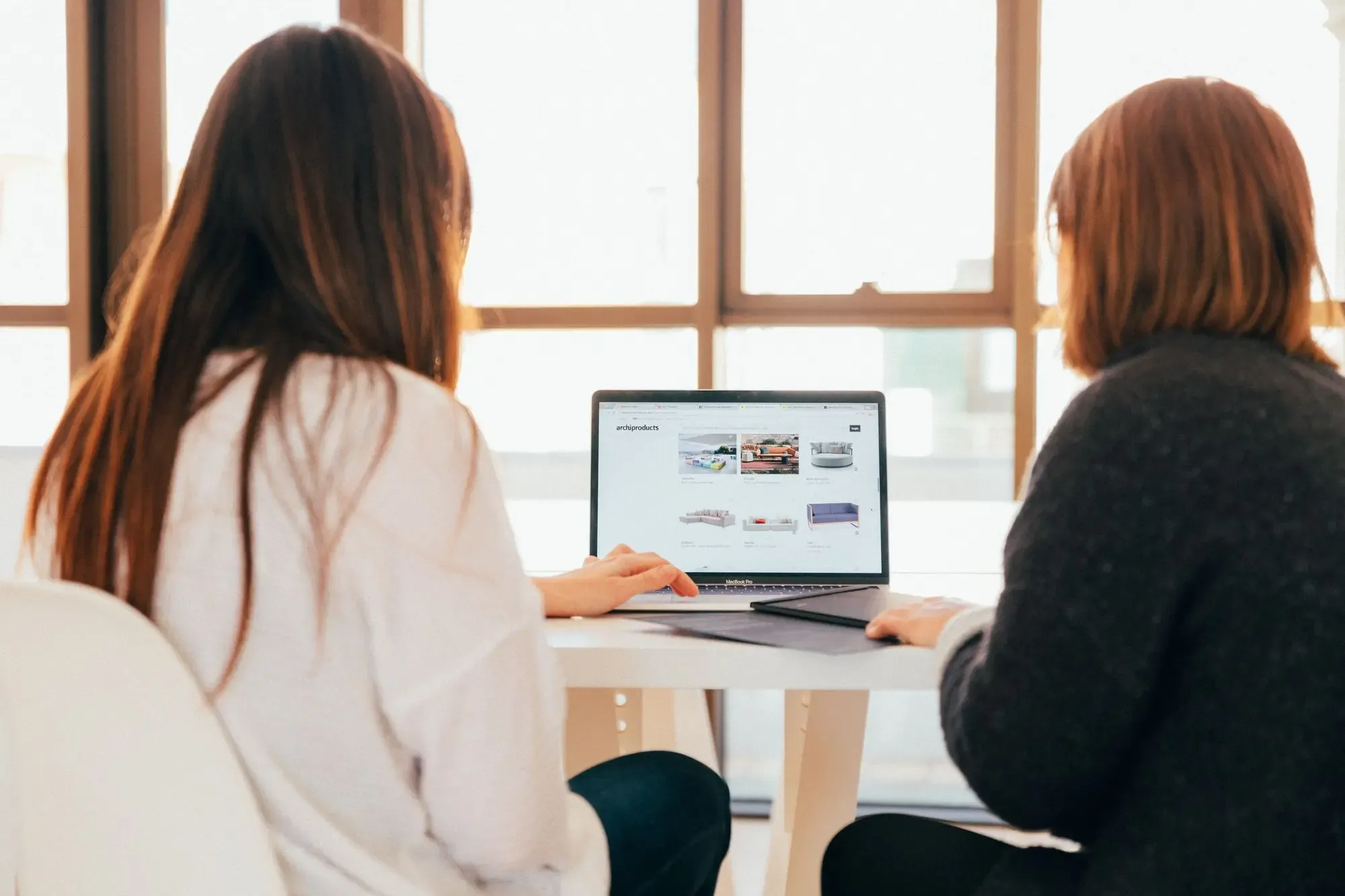 Two woman working together