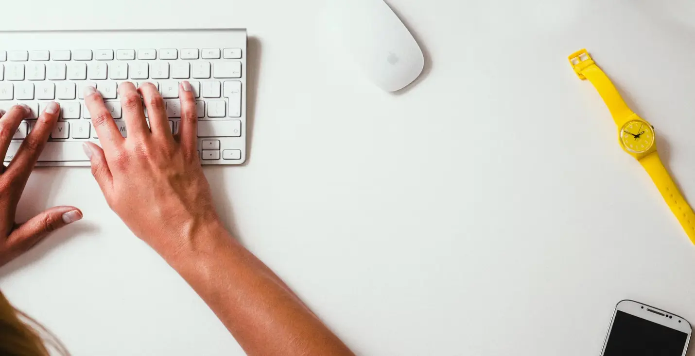 person engaged in remote work using a keyboard