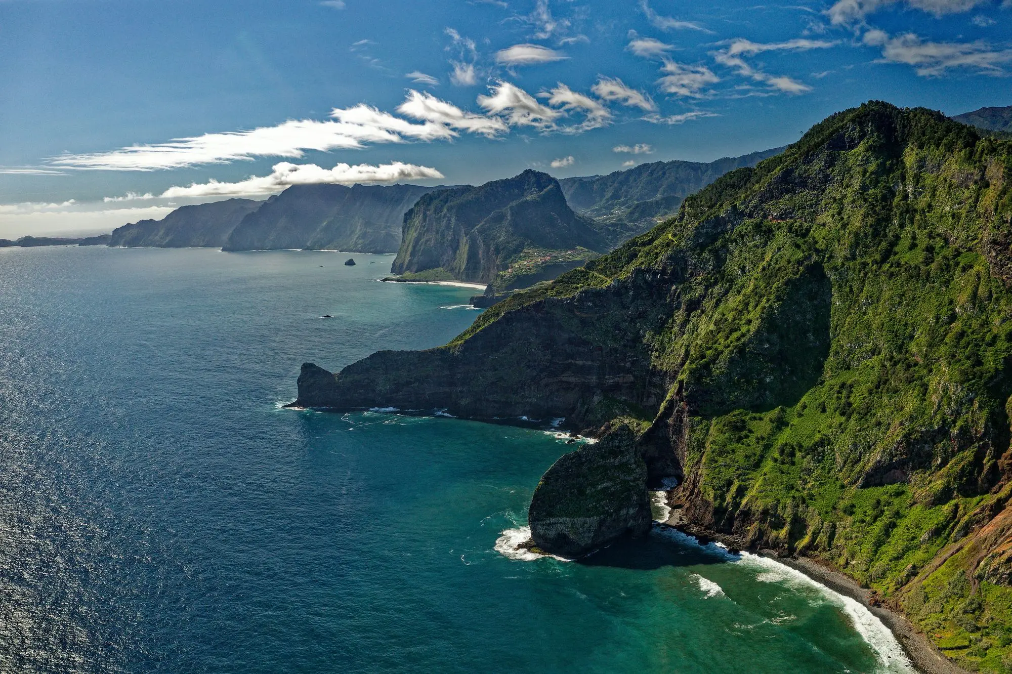 Mountains beside body of water in Madeira