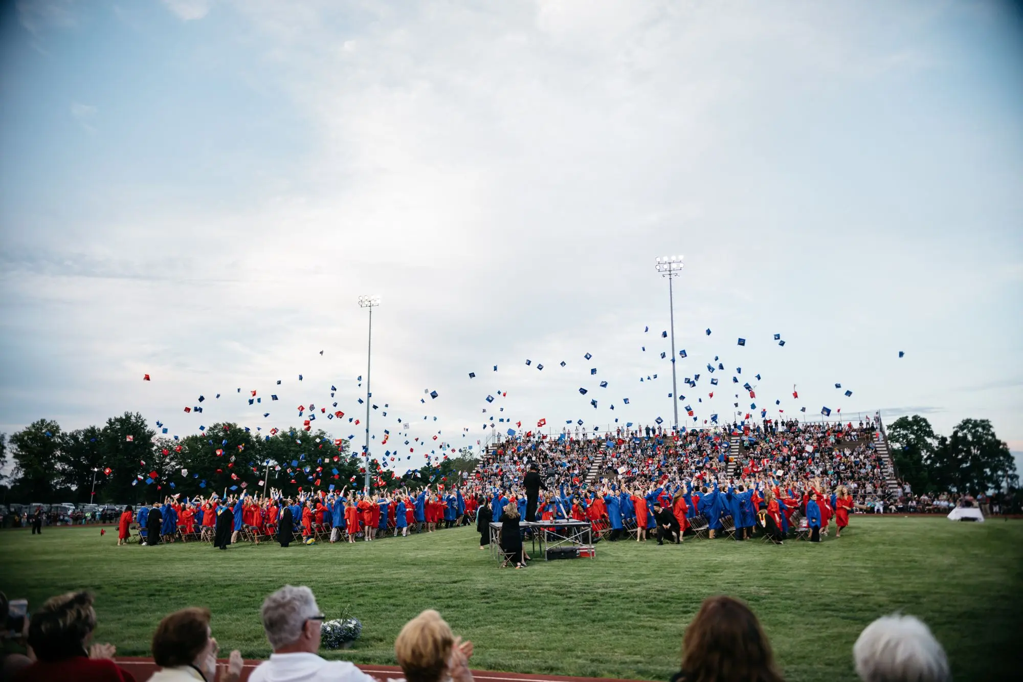 students throwing their mortar boards