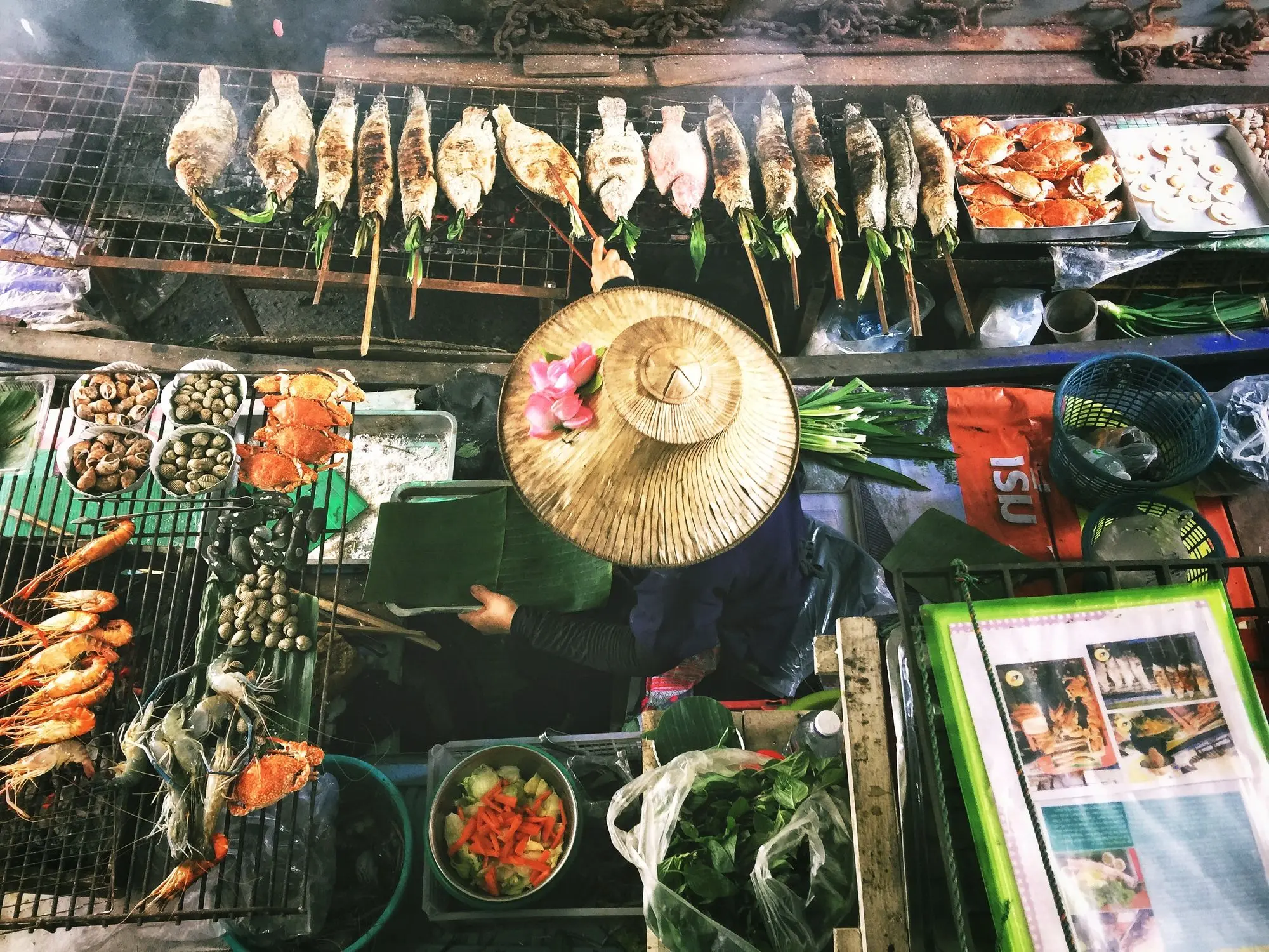 Person wearing asian conical hat
