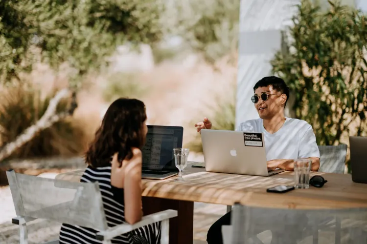 People engaged in remote work outdoors